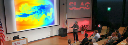 PHOTO: Speaker addressing audience in SLAC auditorium