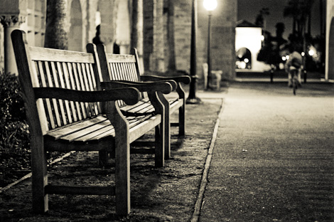 Empty benches in the Quad at night