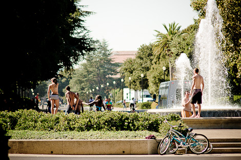 Students cooling off in the fountain in front of Hoover Tower