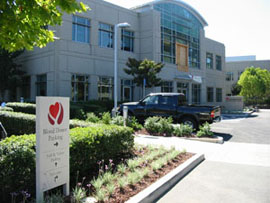 Signs direct donors to special blood donor parking.