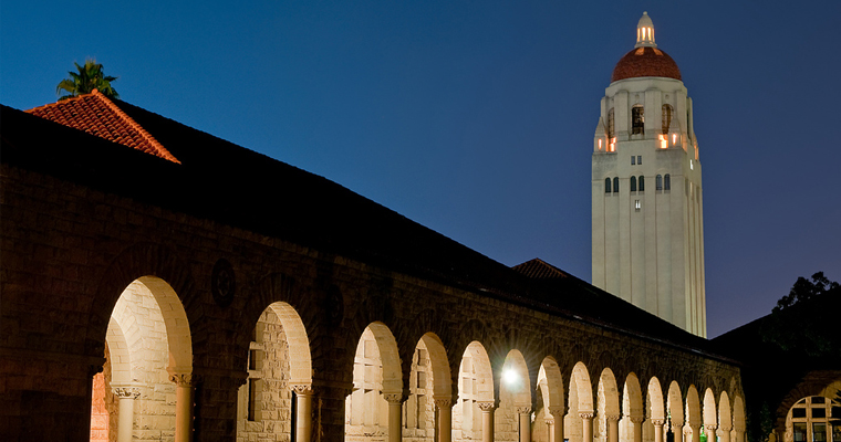 a beautiful night shot of the Stanford Quad featuring Hoover Tower