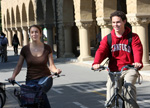 Couple of students riding bikes