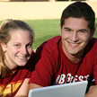 Two students smiling