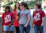 Group of women students wearing Red Zone shirts