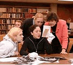 PWR instructor and students examine documents in Special Collections