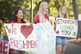 Orientation Volunteers welcome arrival of new students to campus.