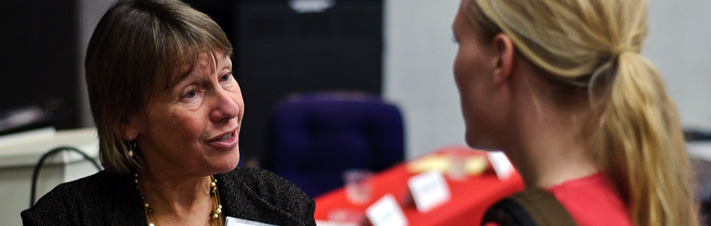 Photo of a Faculty member Pam Grossman talking to a student