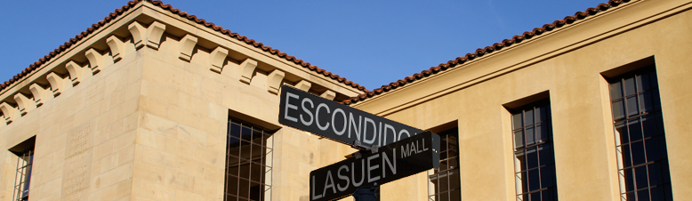 Photo of Cubberley Education Building and a street sign of Escondido and Lasuen Mall intersection