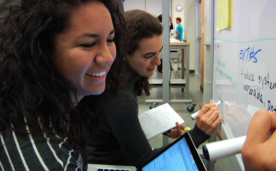 Students using whiteboards in CoLab classroom
