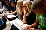 Students set up their donated laptop computers on the first day of school at Joplin High School in Joplin 