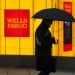 photo of passerby in front of wells fargo branch