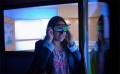 Claudia Nuñez tries on the virtual reality goggles.