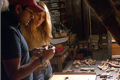 Stanford Assistant Professor Krish Seetah and Reading University student Rose Calis analyze animal bones in the basement of Riga Castle, Latvia./Photo: Aleks Pluskowski