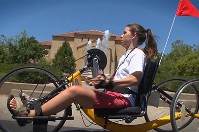 Student Molly Fausone riding a hand-operated bicycle on campus /Photo: Courtesy of the Office of Accessible Education