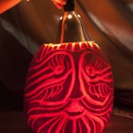 A pumpkin carved by Gail McNulty, an affiliate with the Knight Fellowship program, glows in the testing area of the ME319 class.