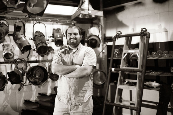 Matt Lathrop portrait in front of theater lighting fixtures