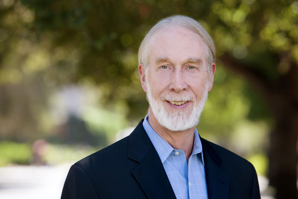 Photo of Scotty McLennan outside on campus.