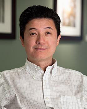 Photo - Portrait of Shoucheng Zhang seated in his office