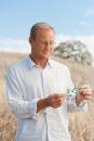 Photo - SLAC Physicist Uwe Bergmann, outside holding molecular model.