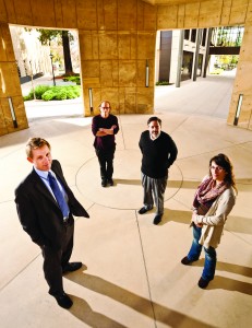 Photo of Welsh, Mills, Marshall, and Acuña by stairway of William H. Neukom Building.