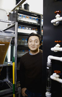 Tohei Yokogawa among fish tanks. He stayed up nights to learn whether zebrafish sleep.